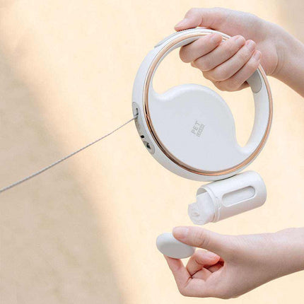 Automatic Lighting Retractable Dog Leash with LED night light, one-button retraction, and built-in garbage bag holder in white color.