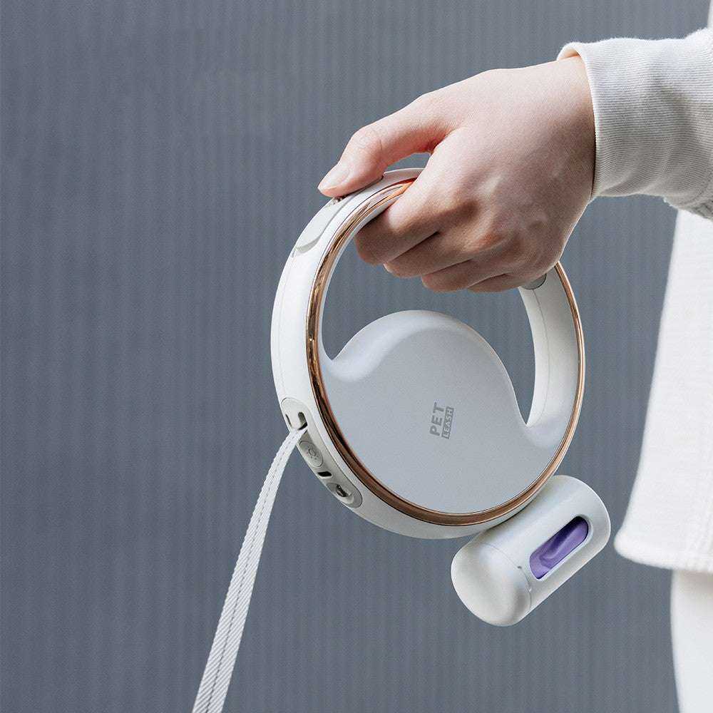 White automatic lighting retractable dog leash with LED night light and built-in garbage bag storage box.