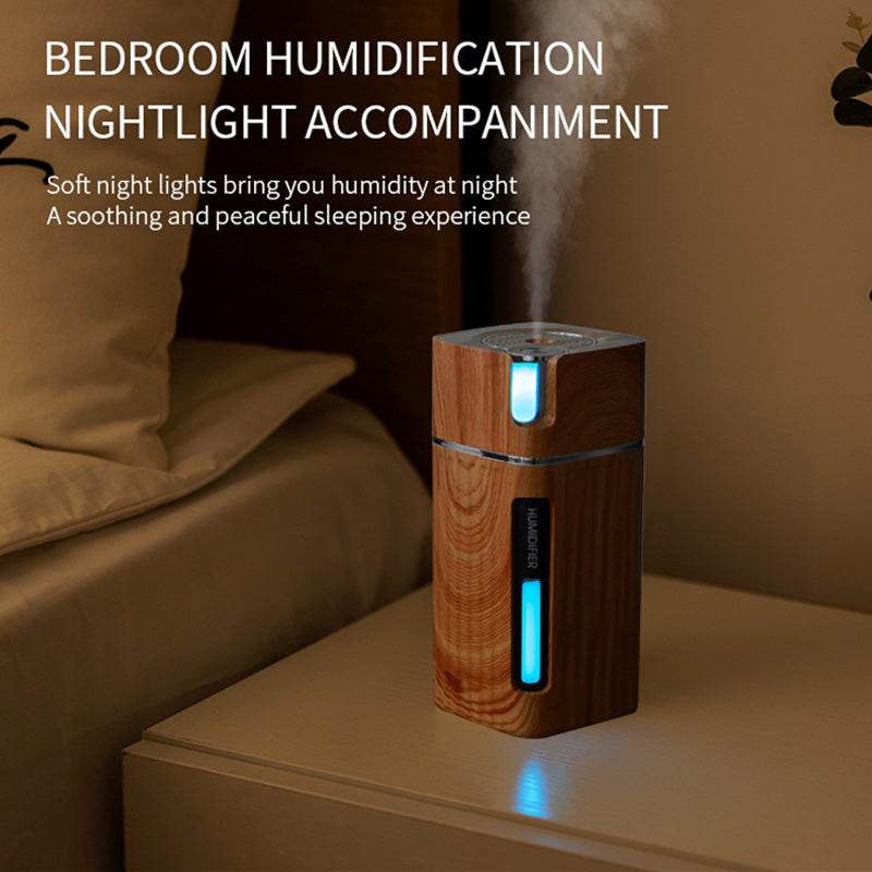 Ultrasonic air humidifier with USB mini mist maker and soft LED night light on bedside table
