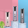 Three electronic devices on cylindrical platforms with a pink and blue background